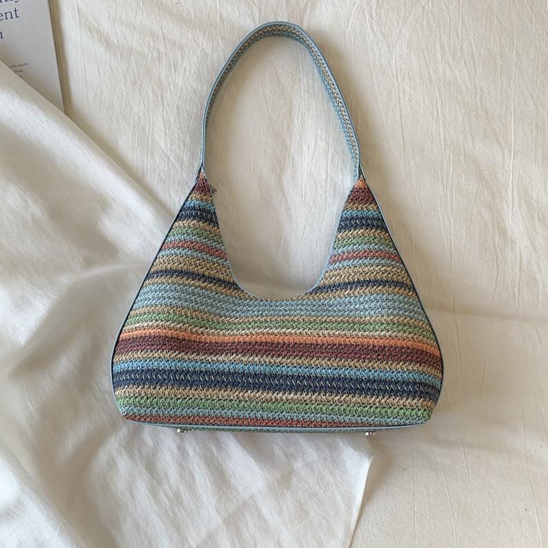 

Contrasting color rainbow strip woven tote bag women s 2025 new seaside straw bag large capacity shoulder armpit bag tide синий