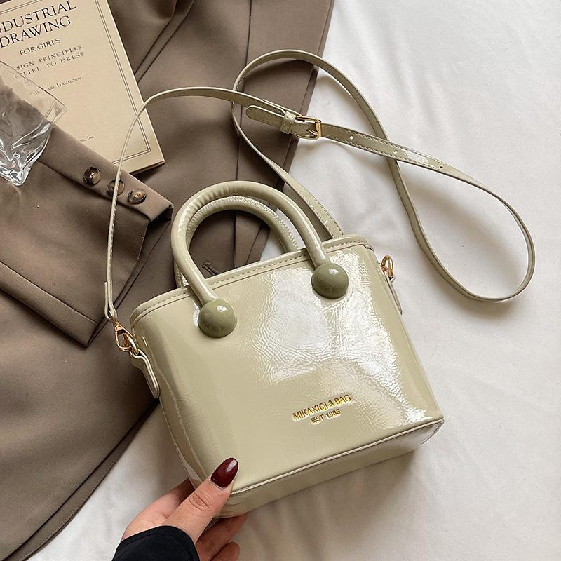 

Весенне-летняя мода новая кремовая простая портативная сумка-ведро корейская версия повседневная для поездок универсальная высококлассная сумка-мессенджер