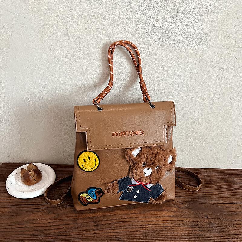 

American retro college style embroidered badge backpack women s 2025 new large-capacity trend bear briefcase