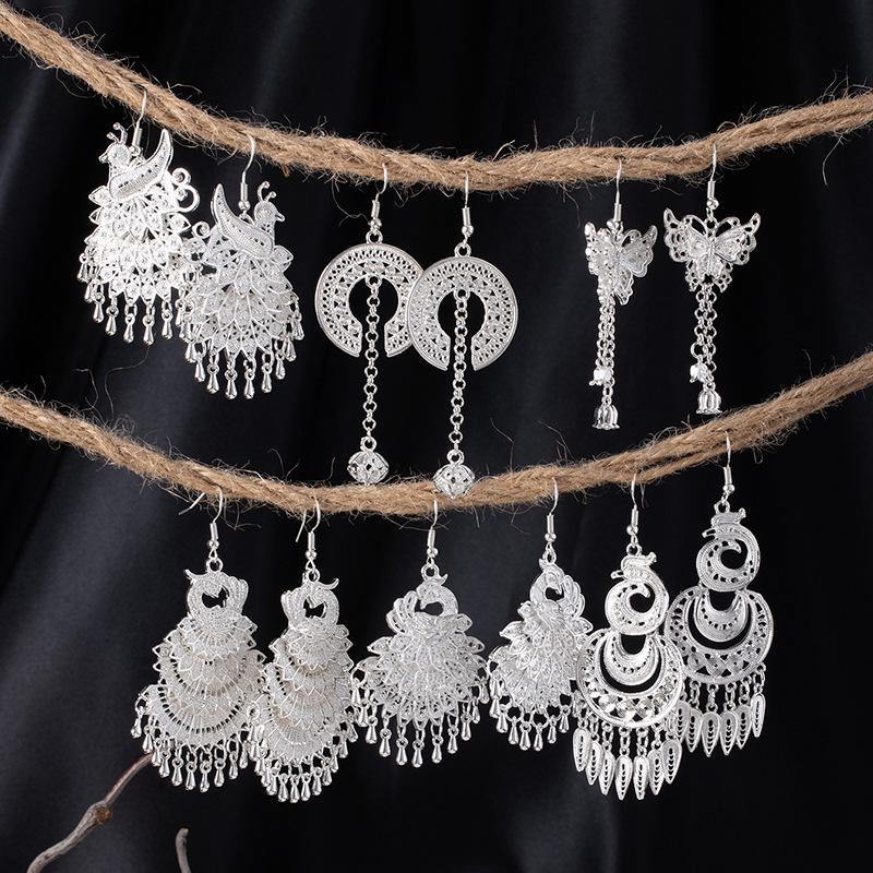 Bohemian Ethnic Miao Silver Tassel Earrings with Butterfly, Peacock, and Flower Design for Women – Long Dangle Jewelry for Travel Photos.