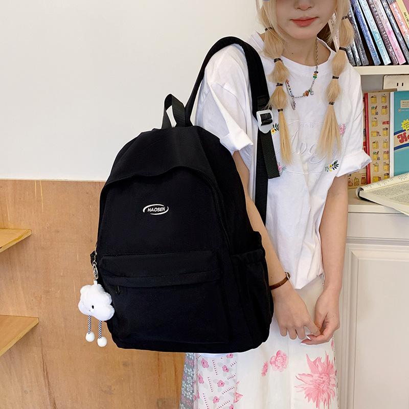 A Simple and Fashionable Backpack with A Large Capacity and A High-quality Texture. It Is A School Bag for Senior High School Students
