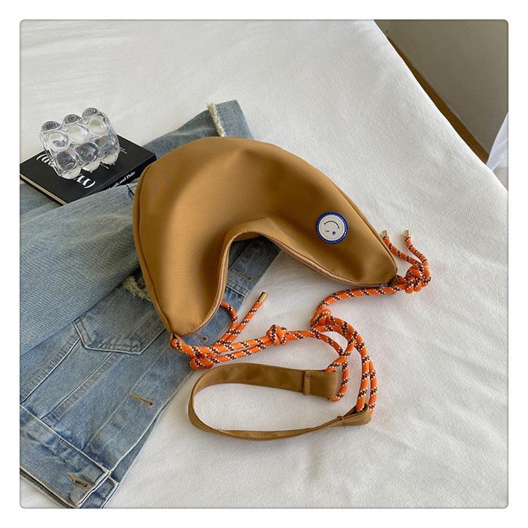 Simple dumpling bag casual 2025 new student schoolbag men's and women's shoulder messenger bag