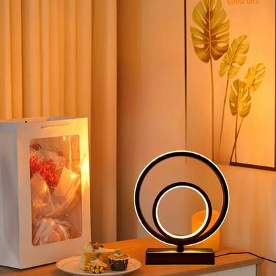 Modern and Minimalist Ring-shaped Desktop and Bedside Lamp. It Is Powered by USB and Has the Function of Three-color Dimming.