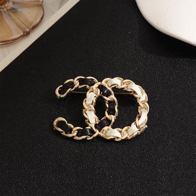Small Fragrant Leather Color-blocked Double-letter High-end Feminine Matching Accessory Brooch