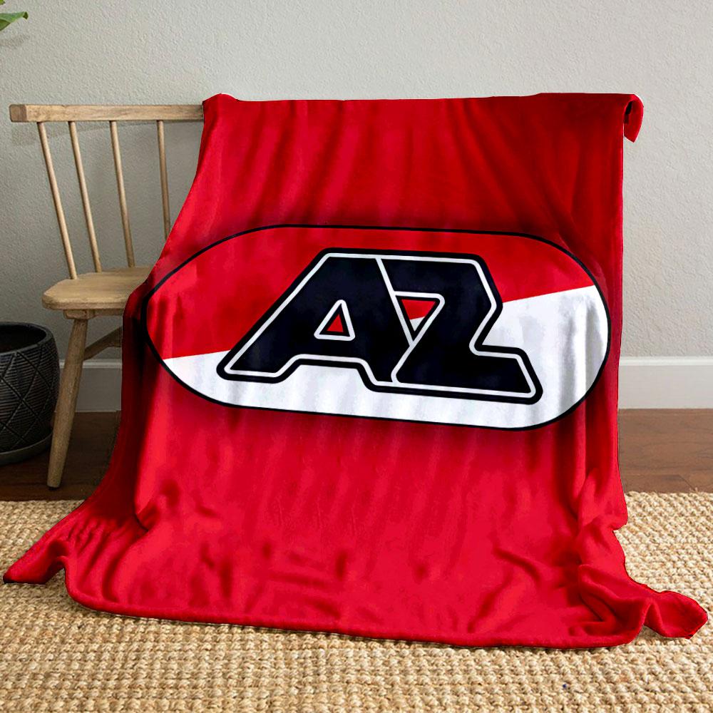 A bold "AZ" logo in black, over a red and white diagonal background. for all seasons blanket lunch break throw gift