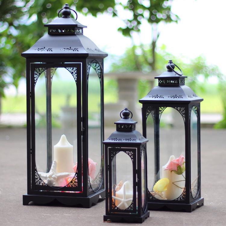 

European Style Wrought Iron Hurricane Lantern Candlestick: Windproof Glass Holder for Home, Courtyard, and Wedding Decor. Black Small+LED Candle