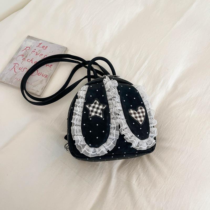 Schoolbag handsome rice family Korean simple foreign style polka dot love rabbit ear backpack 1011 spring new commuter student backpack