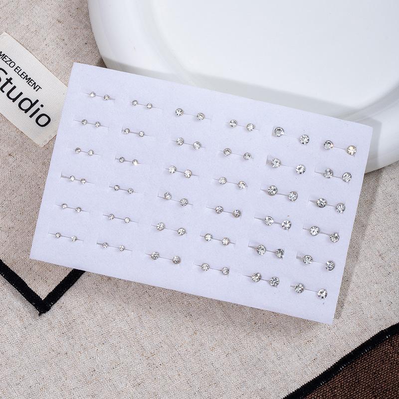 Набор мини-серьг-гвоздиков с цветами Комбинация 36 пар цветных бриллиантовых серег-гвоздиков с цветами 50 пар простых геометрических серег-гвоздиков со стразами