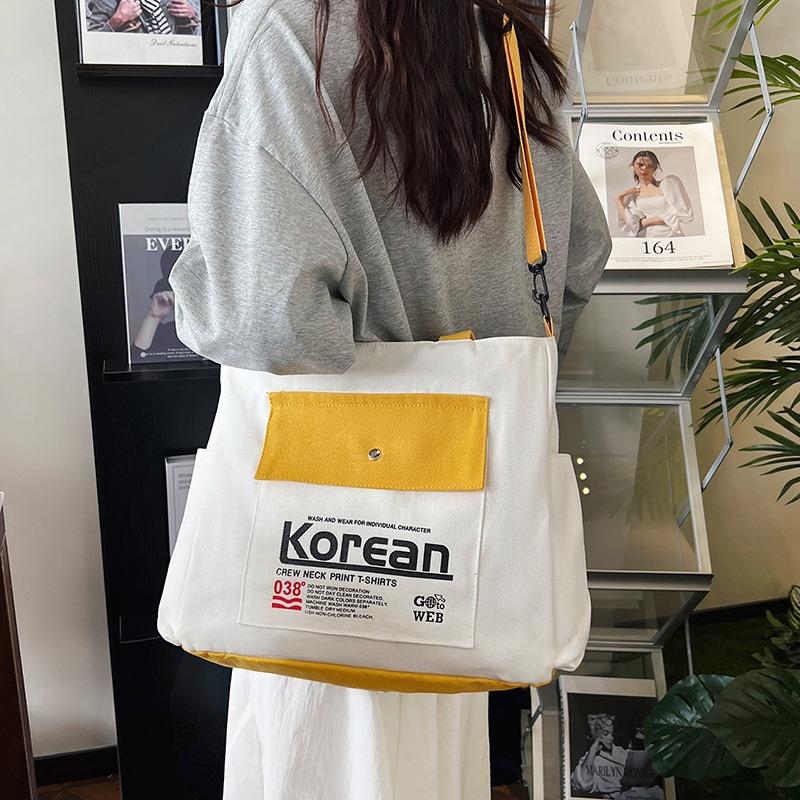 Simple style women's hand-held canvas bag New trendy versatile messenger shoulder bag Large capacity student commuter armpit bag