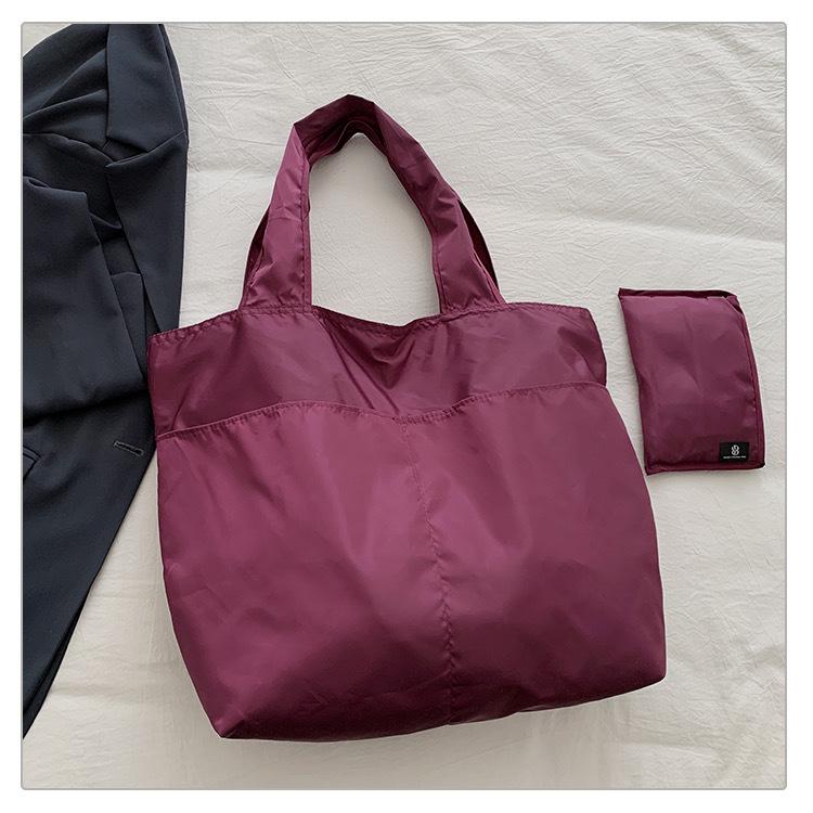 European-American Fashion Large Capacity Travel Bag - Solid Color, Nylon, Handheld or Shoulder Style for Women