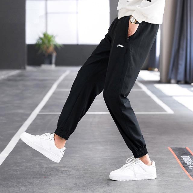 Li Ning Table Tennis Series Solid Color Logo Print Quick-Dry Tapered Woven Sports Casual Pants Men Pants Black AYKT551-7