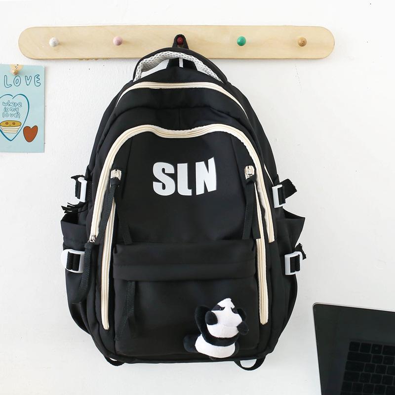 Large capacity ins wind backpack female junior high school high school student lightweight schoolbag computer backpack male trendy model
