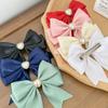 Heart-shaped pearl ribbon clip, pink [product]
