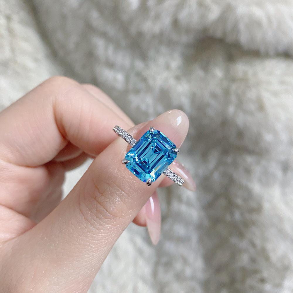 Aquamarine Emerald-Cut Ring In 925 Sterling Silver with Pave Diamonds, Plated In PT950 Gold.