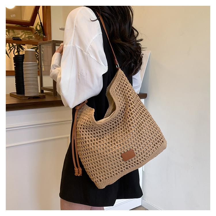 Strandtas Damen neue hohle gewebte Schultertasche mit großem Fassungsvermögen tragbare Tragetasche Eimertasche