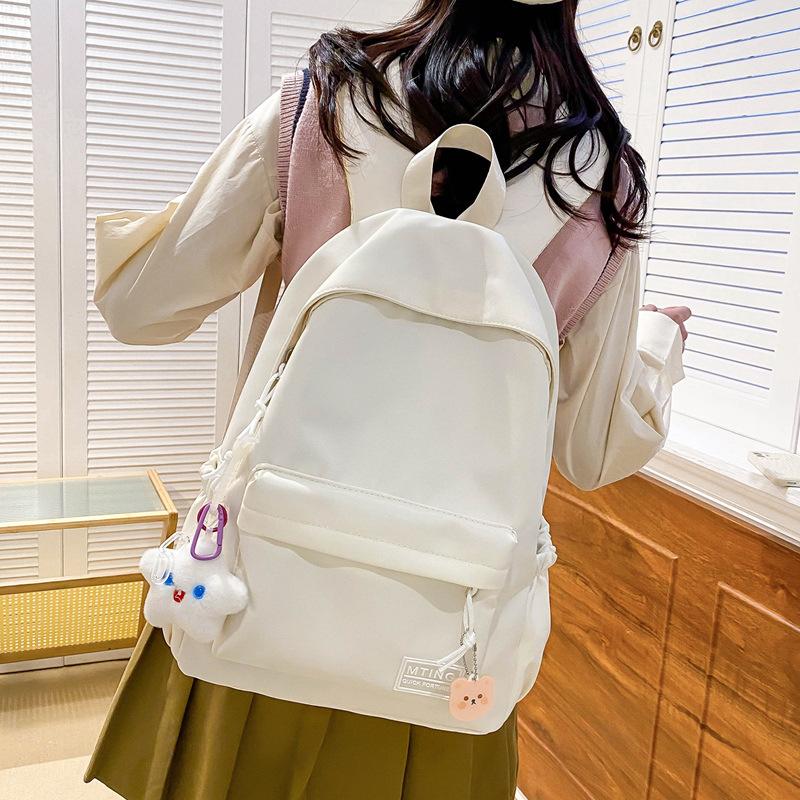 Small fresh girl backpack Japanese solid color schoolbag female Korean version ins versatile large capacity student backpack new