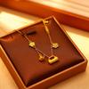 Exquisite Sparkling Sand Gold Four-Leaf Clover Tassel Necklace – Ethnic Style, Long-Lasting Color, High-End Feel