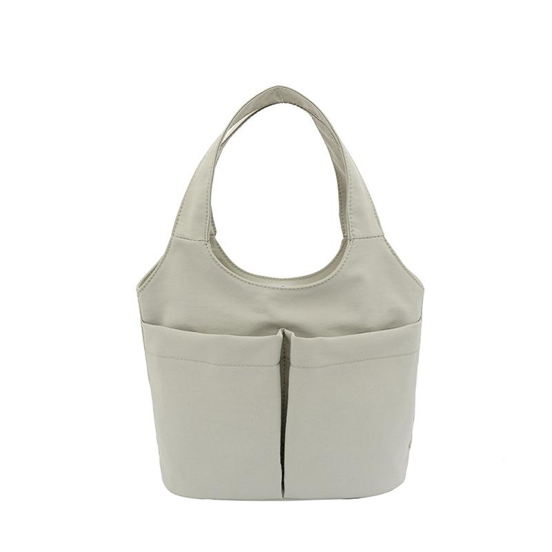 Women's casual simple solid color multipocket summer new fashion go out portable handbag