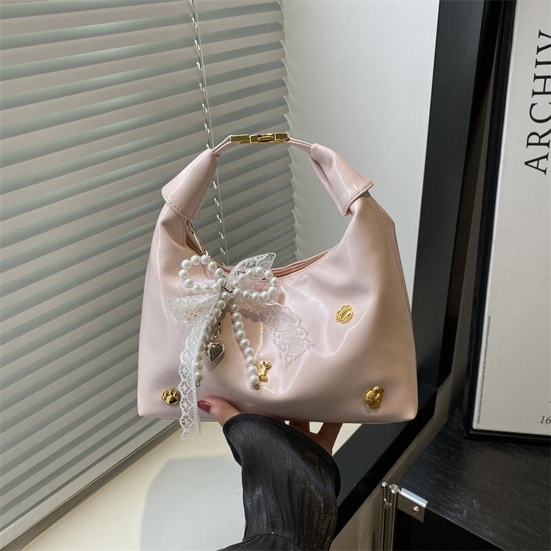 

New women s bags are fashionable and beautiful, personalized and fashionable niche handbags, shoulder and underarm messenger bags. no pendant розовый