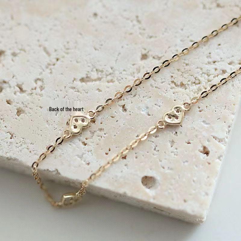Japanese S925 Sterling Silver Heart-Shaped Bracelet with 14k Gold Plating, Featuring Three Small Cold Style Hearts. Simple and Elegant Design.