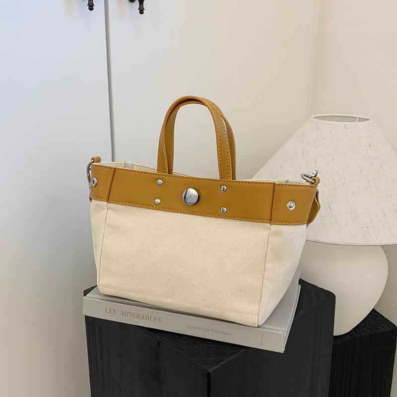 

Simple and versatile commuter shoulder women s bag New large-capacity canvas bag Portable contrasting messenger bag