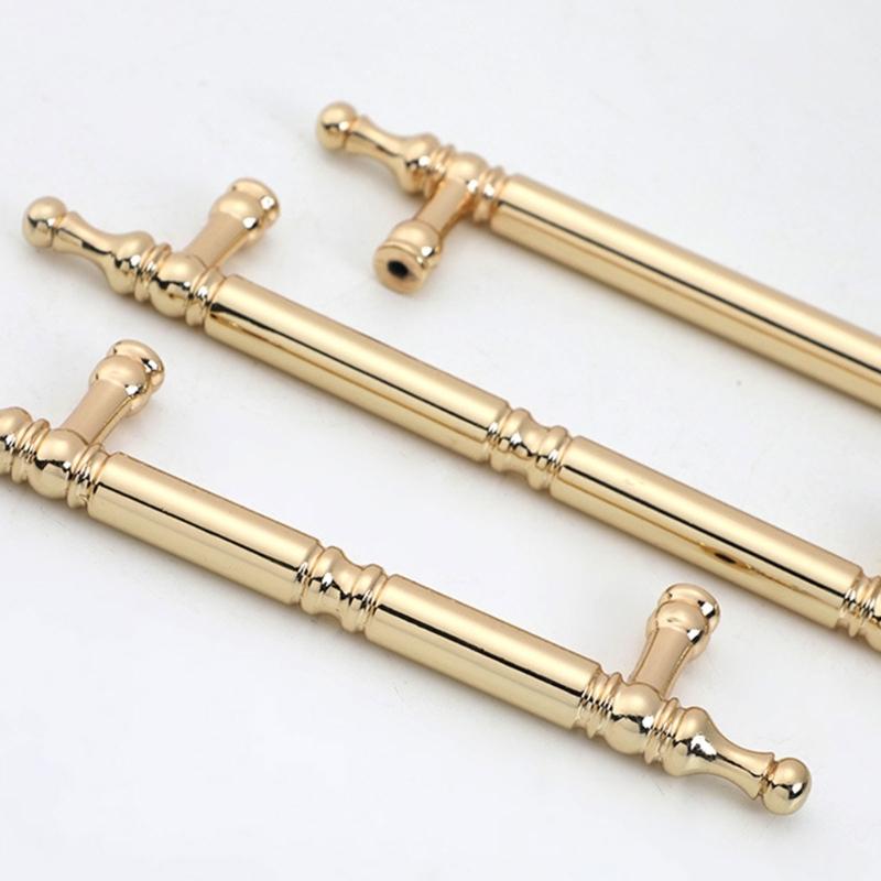 Skříňkové úchytky se zlatou povrchovou úpravou Ergonomický design Hardware odolný proti korozi Jednoduchá instalace Pro kuchyňské skříňky Komody