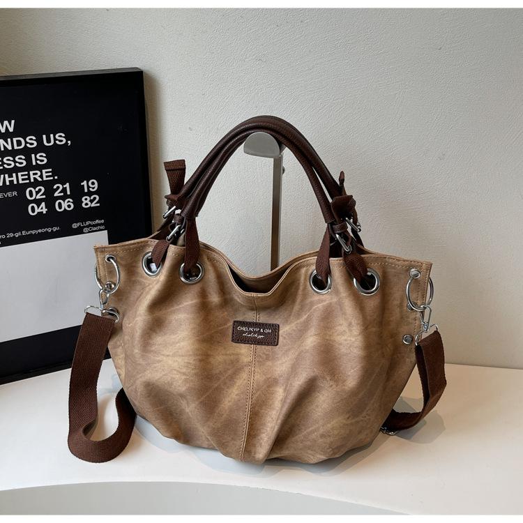 

Ретро портативная сумка большой вместимости женская 2025 новая трендовая нишевая дизайнерская сумка-тоут простая и продвинутая сумка-мессенджер