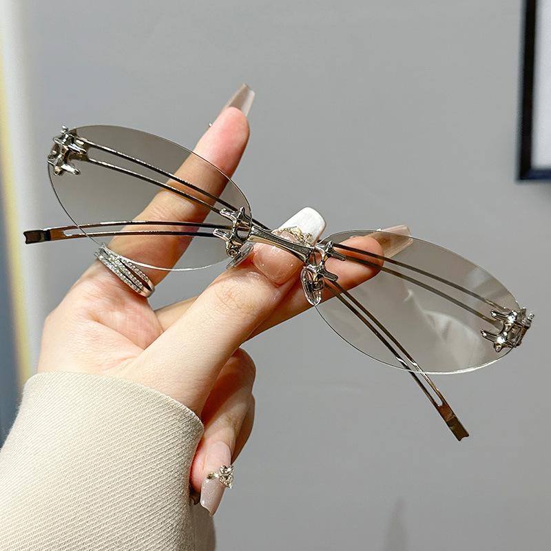 

Vintage Frameless Oval Metal Premium Mesh Water Silver Sunglasses European and American Spice Girls Style Sunglasses zinc alloy temples