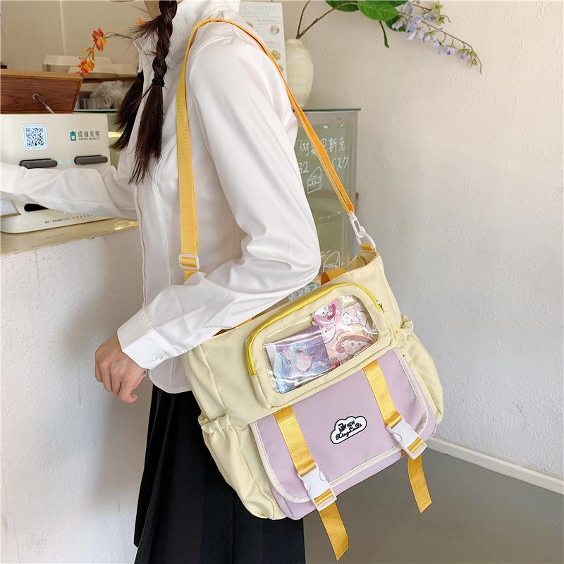 Large capacity messenger bag female college student class leisure commuter bag make-up bag cute contrasting color portable shoulder bag