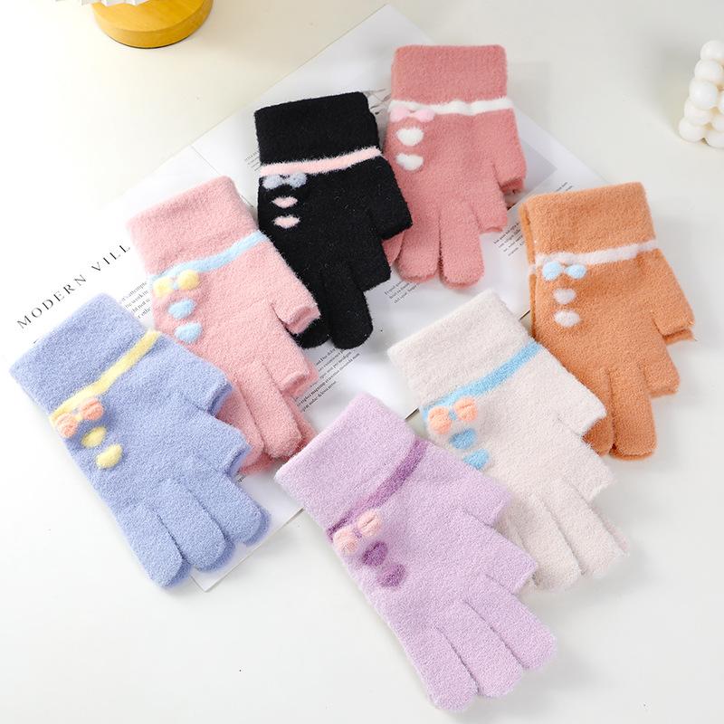 Wool gloves show two fingers, women keep warm in winter, knit for cold protection, draw and write, students play with mobile phones with two fingers