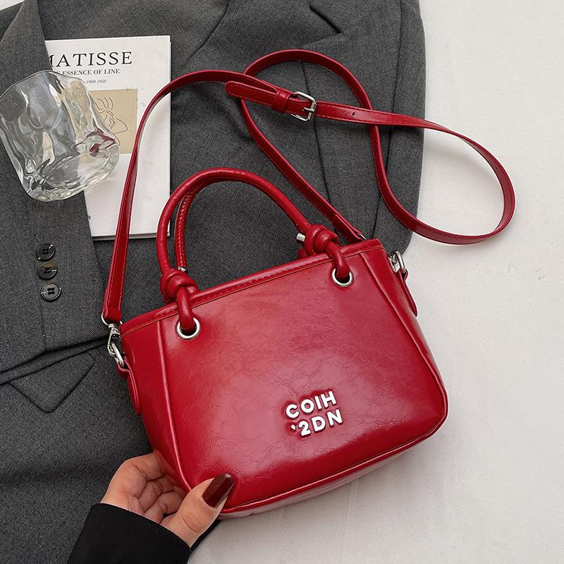 

Wholesale fashion classic Korean version casual simple portable bucket bag women commuting versatile solid color texture pu messenger bag