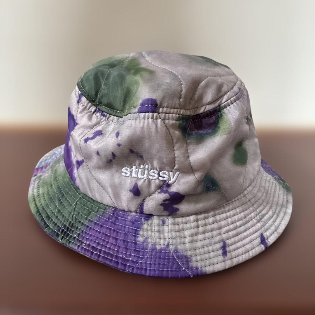Used Stussy quilted bucket hat with tie-dye pattern