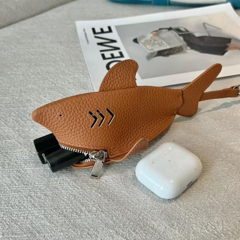 New leather dolphin change bag, keychain pendant, cute fashion earphones, lipstick storage bag.
