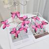 An artificial butterfly branch used for weddings, family offices, parties, decorating vases, and floral arrangements