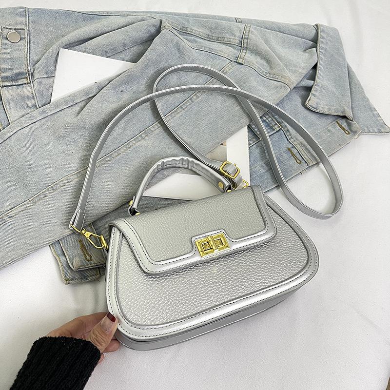 Spring niche design fashionable contrasting color saddle bag portable shoulder crossbody trendy women's bag