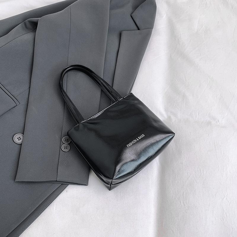 

Новая нишевая сумка-тоут летняя простая и универсальная однотонная простая ручная сумка для повседневной носки чёрный