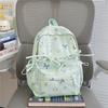 Cute Bow Tie Print School Backpack Lightweight Nylon Zipper Daypack with Front Pocket for Teen Girls Daily Travel