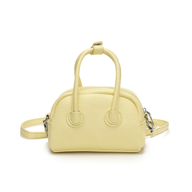 

Korean popular niche simple lychee pattern portable Boston bag casual high-end commuting versatile messenger women s bag жовтий