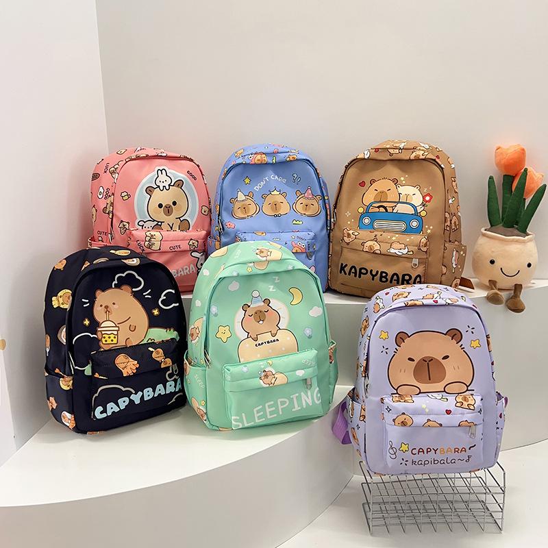 Fashion temperament Trend backpack Junior high school primary school schoolbag Large capacity decompression backpack Cartoon cute student bag