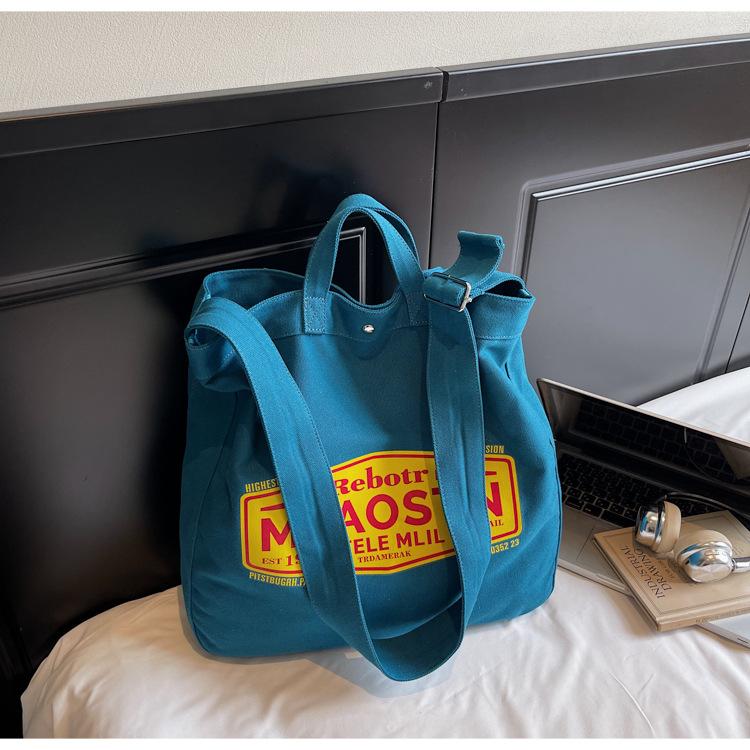 Korean niche tote bag canvas bag women s 2025 new large capacity casual tote bag fashion letter crossbody bag