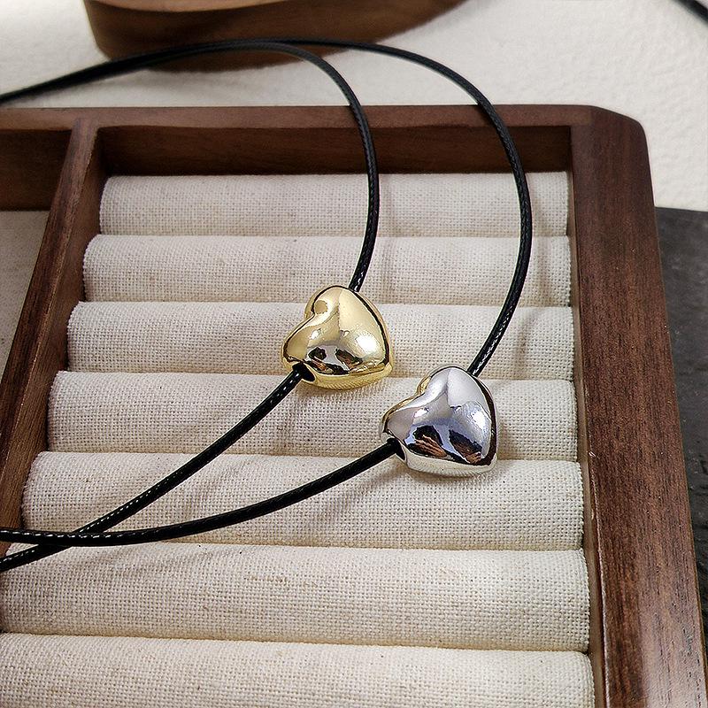 Korean-Style Heart Necklace: Versatile Black Rope with Niche Peach Heart Pendant, Adjustable Sweater Chain for Women.