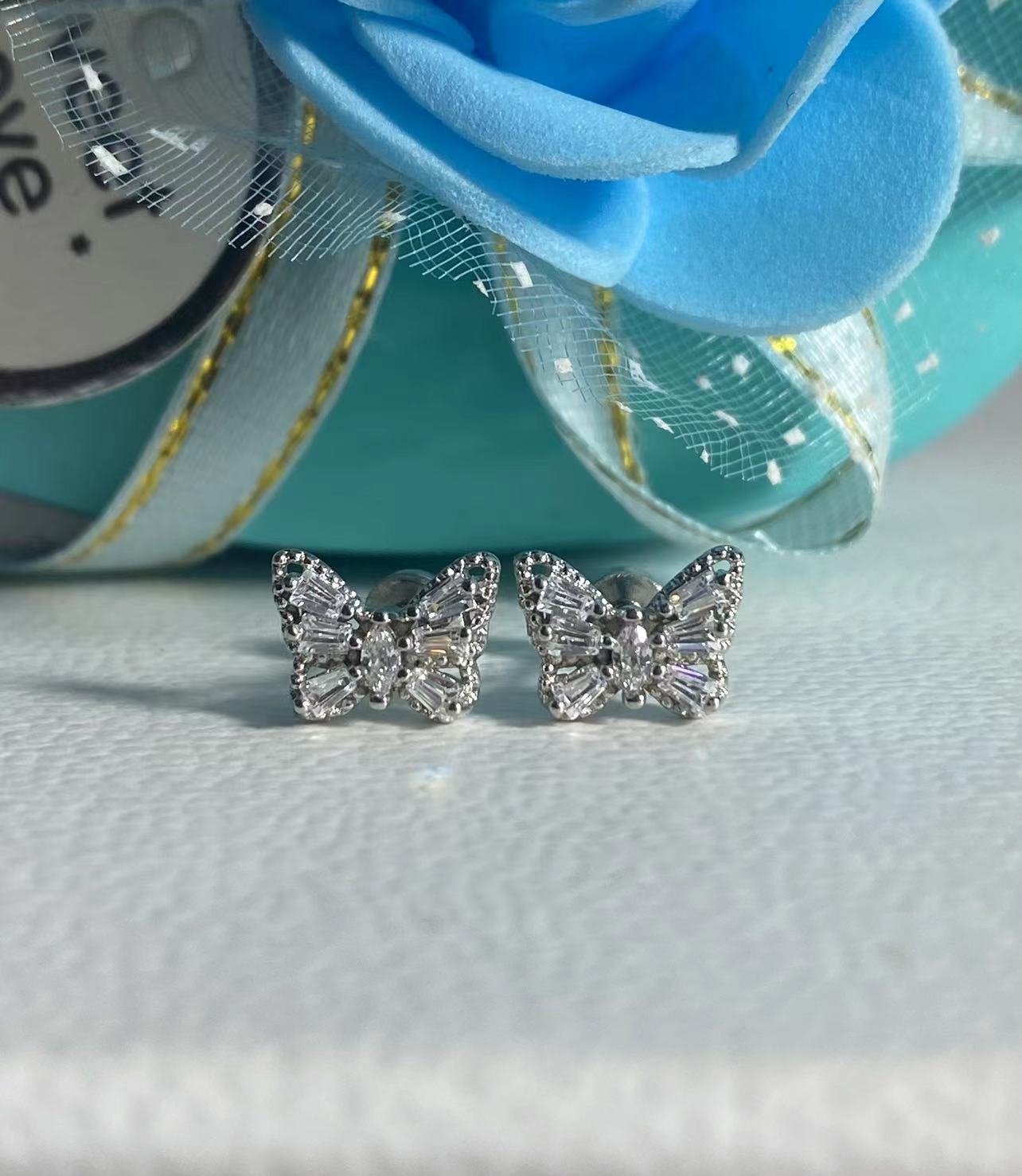 Butterfly zircon earbone nails Titanium steel flat bottom screws Super flash drill cochlear nails Niche temperament sweet stud earrings female