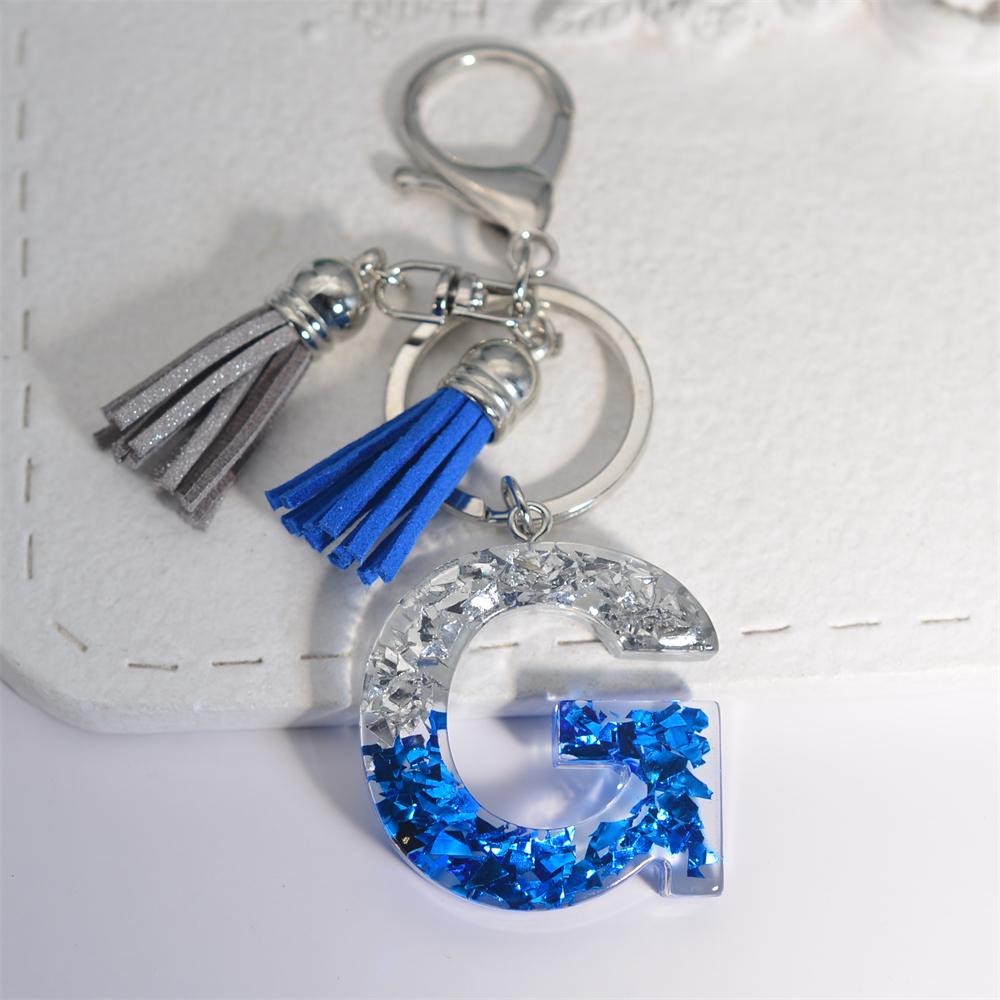 Креативные брелки из смолы с 26 буквами и кисточками — фото 14