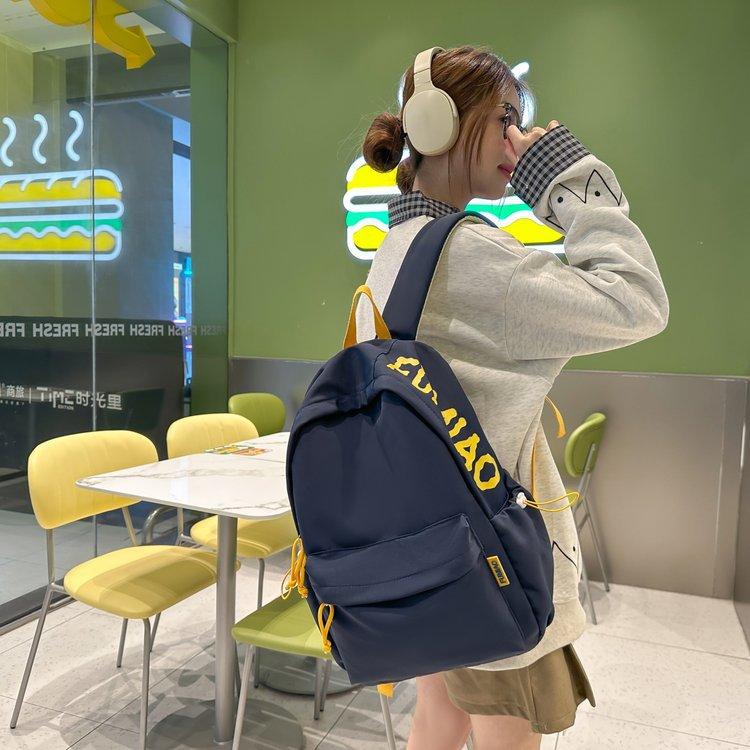 Schoolbag Korean version ins Large capacity solid color campus simple and lightweight versatile letter schoolbag 3rd to 6th grade students shoulder