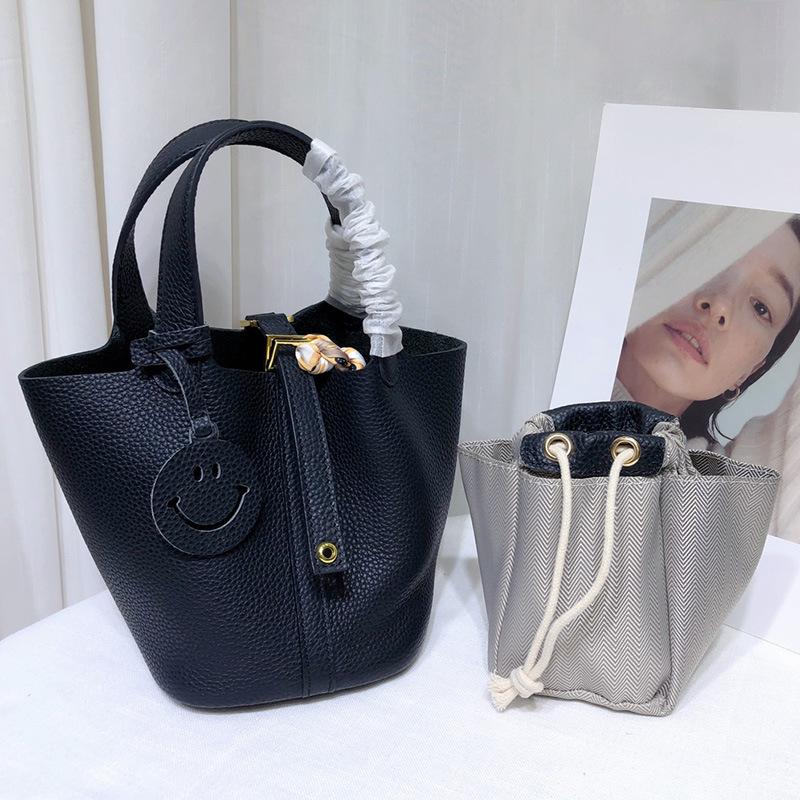 Spot wholesale top layer cowhide vegetable basket bag leather bucket bag commuter fashion lock buckle hand-held handbag woman