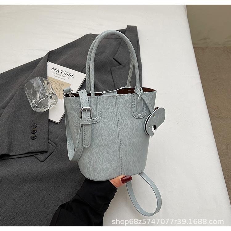 Korean simple style portable bucket bag women's 2025 summer new fashionable and popular one-shoulder crossbody vegetable basket bag