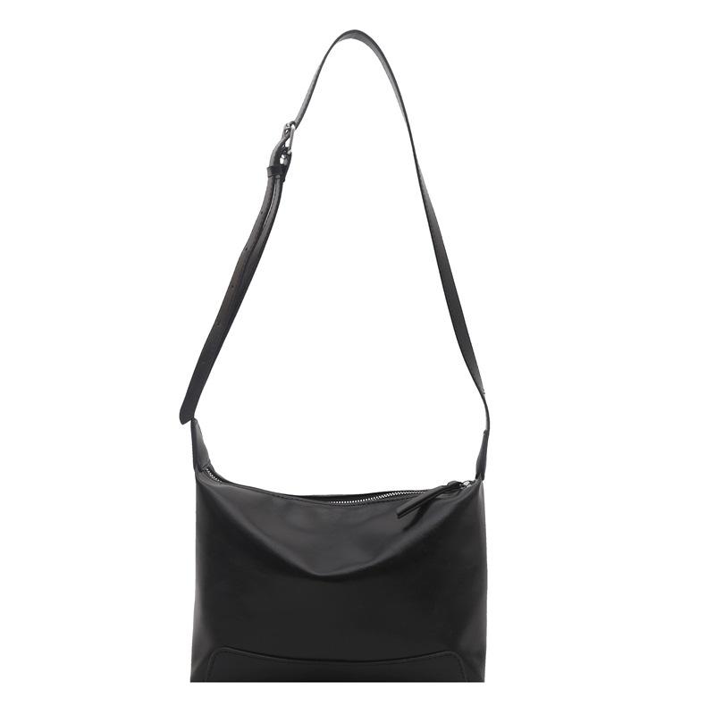 Eine Retro-Tragetasche mit großem Fassungsvermögen und lässigem Stil und eine einfache Umhängetasche für den Arbeitsweg