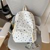 Star-Printed Backpack with Front Zipper Pocket and Tassel Details for School and Daily Use