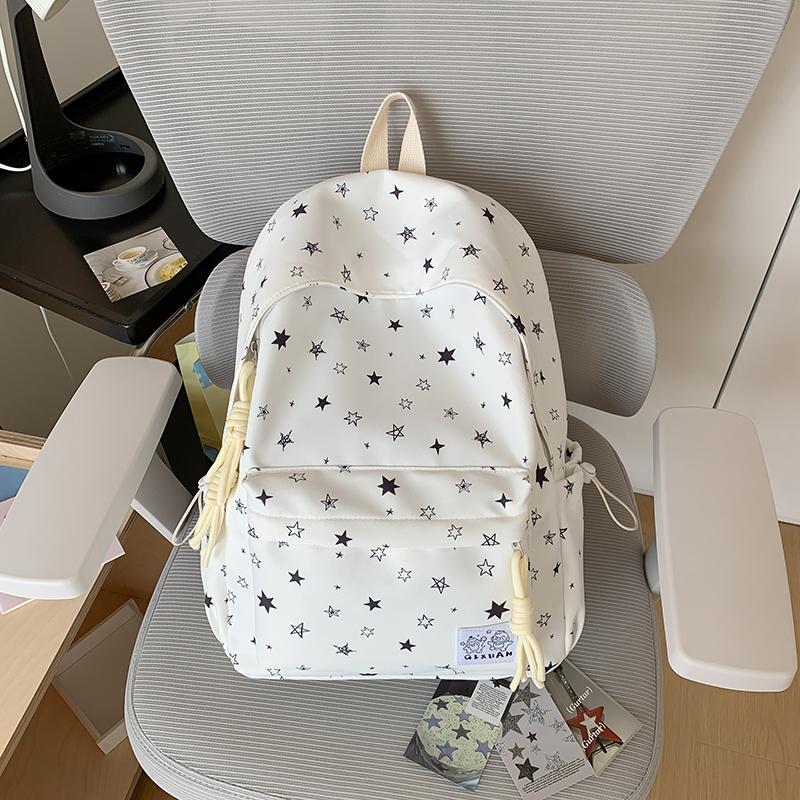 Star-Printed Backpack with Front Zipper Pocket and Tassel Details for School and Daily Use