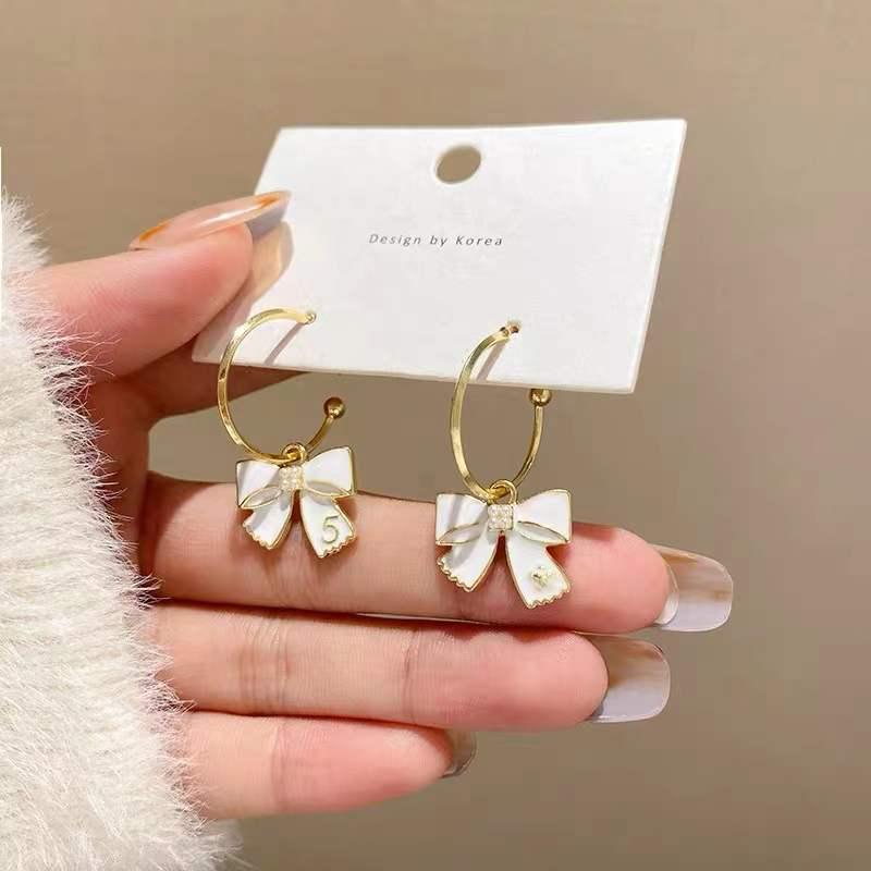 

Sterling Silver Korean Bow Hoop Earrings - Trendy, Simple, Goddess Style Studs.